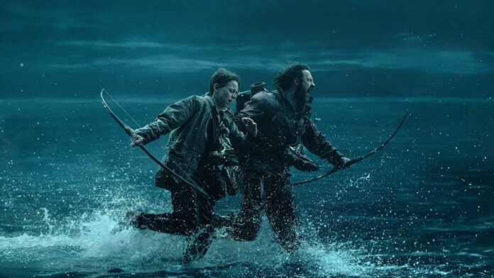 28 years later causeway A boy and a man dressed in brown jackets, holding bows, and running across water in 28 Years Later.