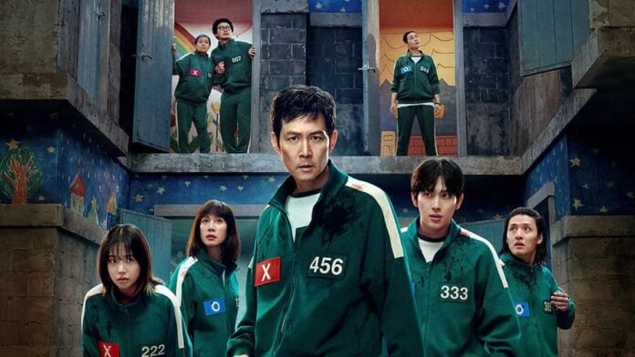 squid game season 3 cover Promo image for Squid Game Season 3. Several men and woman in green jumpsuits stand in a row.