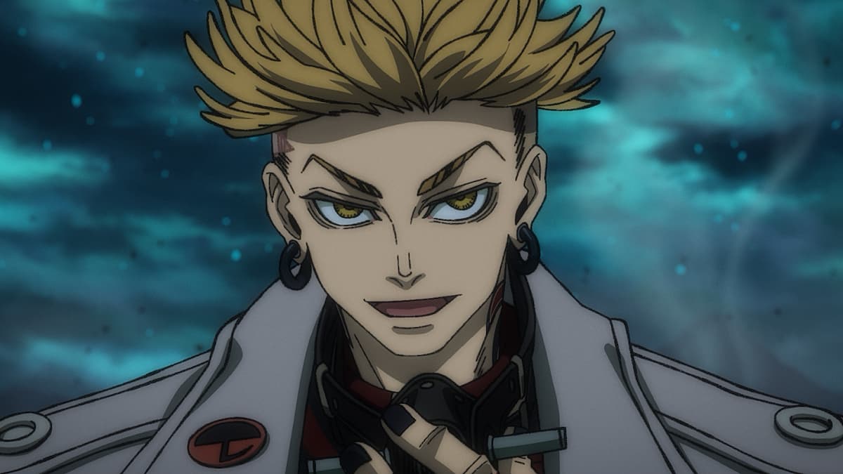 A blonde boy with dark earrings.