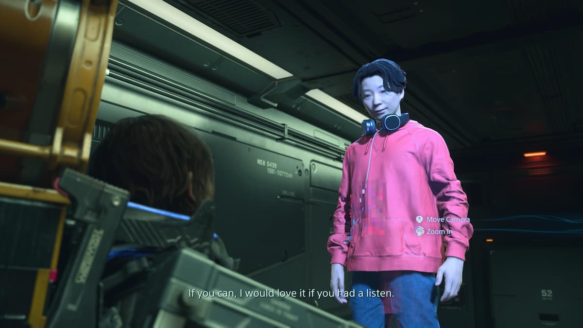A Japanese man in a pink hoodie.