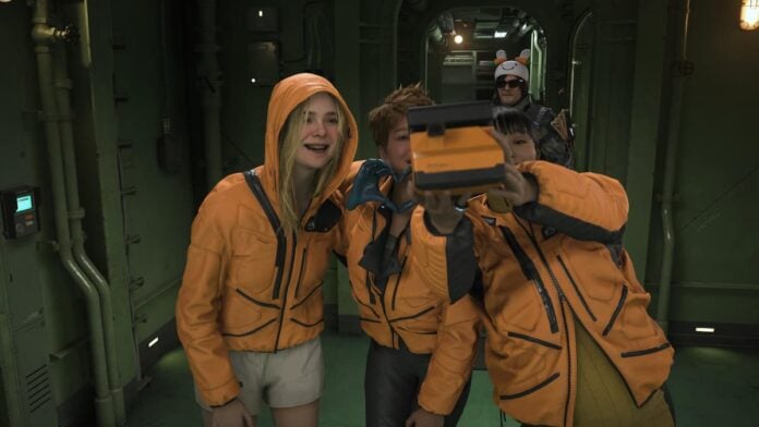 death stranding 2 group photo Three women in orange jackets taking a selfie with a polaroid camera. Cover image for our Death Stranding 2 review.