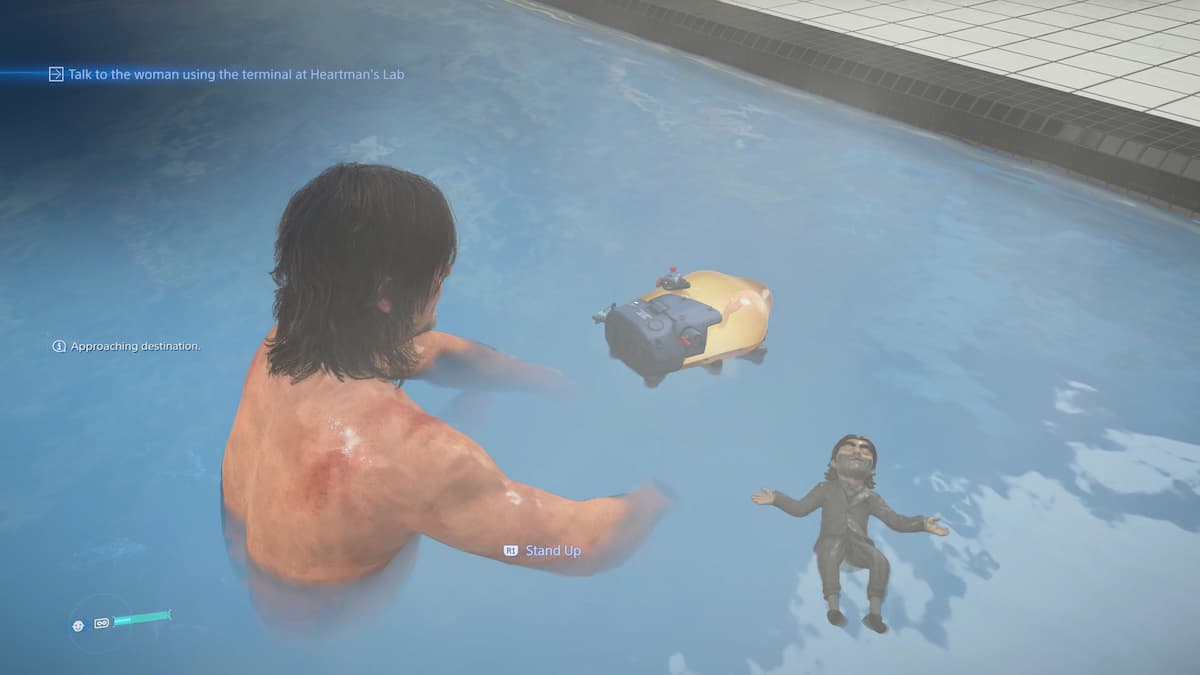 A man sitting in hot springs with a suited doll.