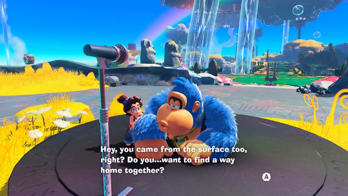 A blue monkey talking to a girl in front of a microphone for our Donkey Kong Bananza review.