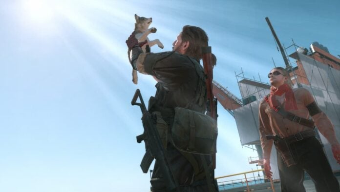mgsv dd king A man holding up a small dog.