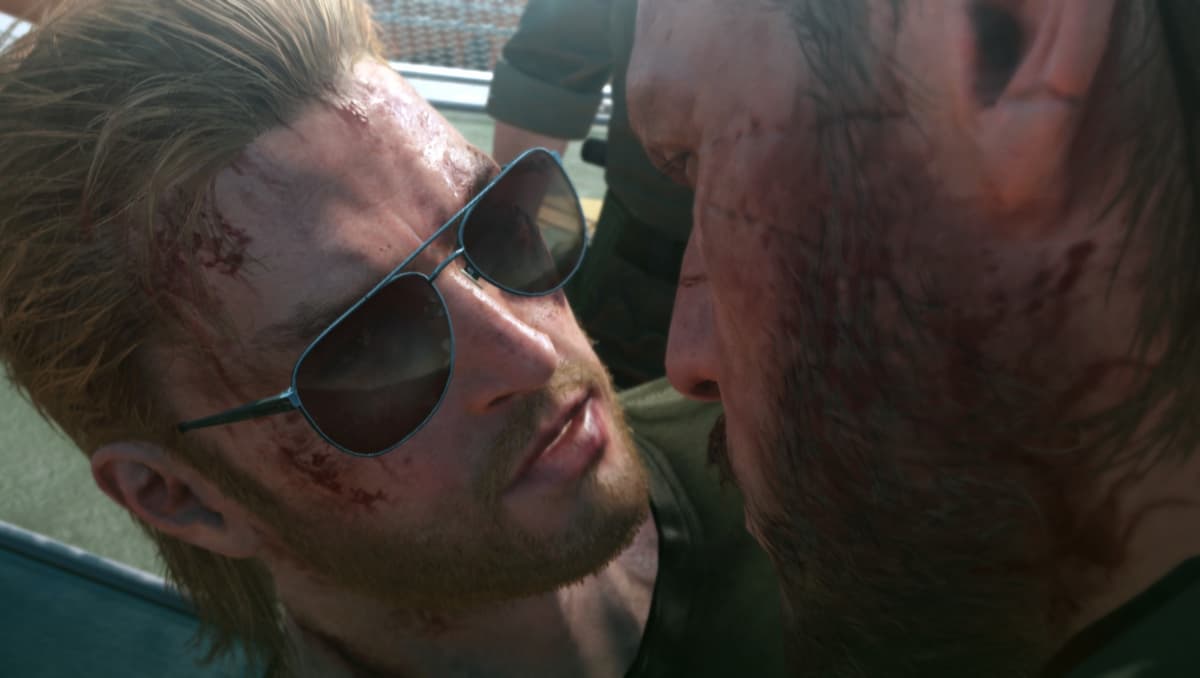 A man in sunglasses close to another man's face in MGS V.