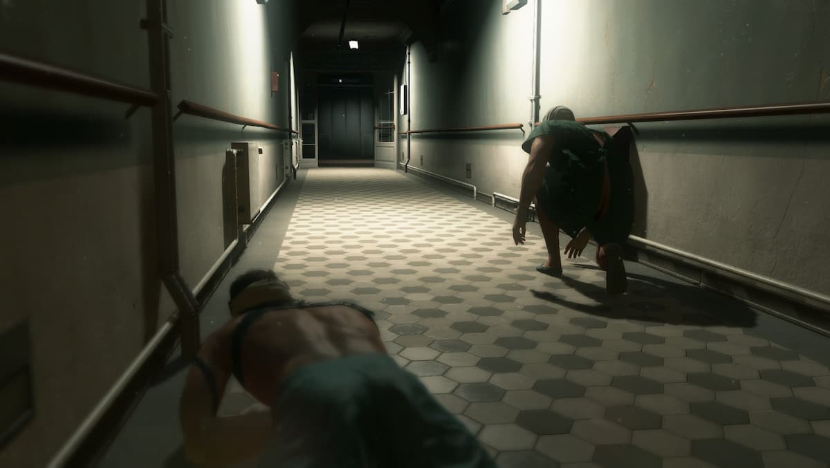 A topless man crawling on the ground.