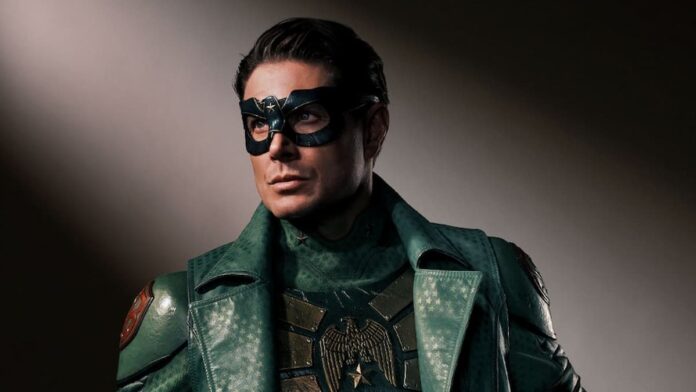 vought rising jensen A man wearing an eye mask and a green coat.