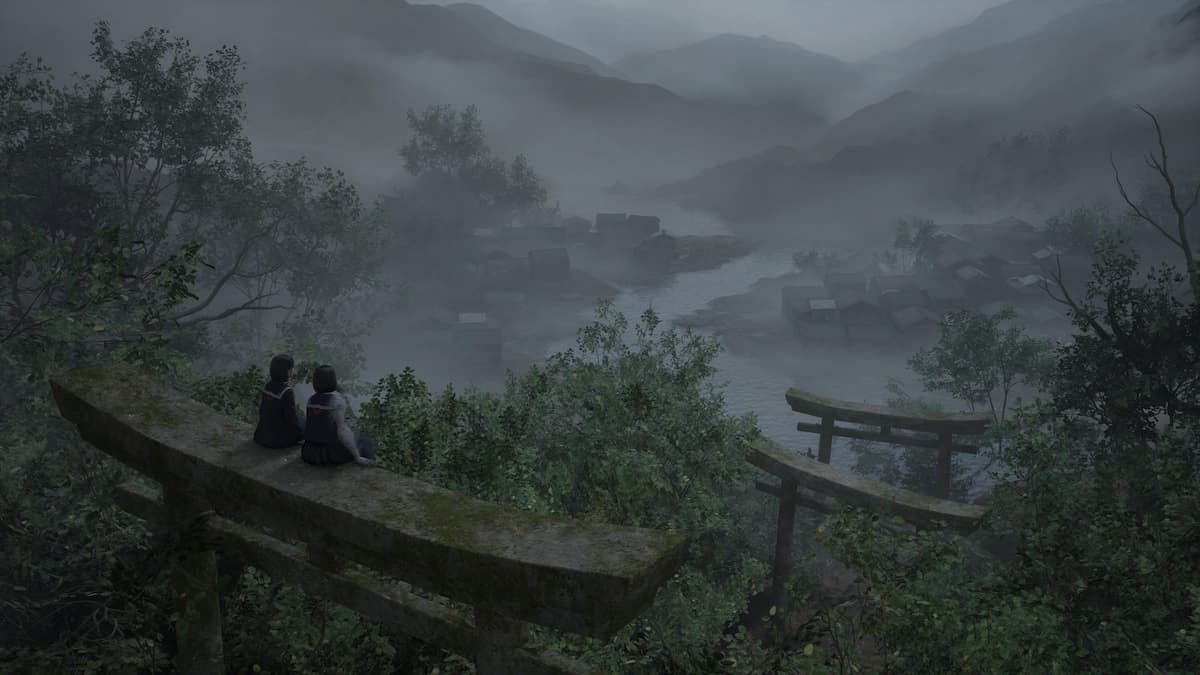 Two girls sitting on a torii gate looking over a town.