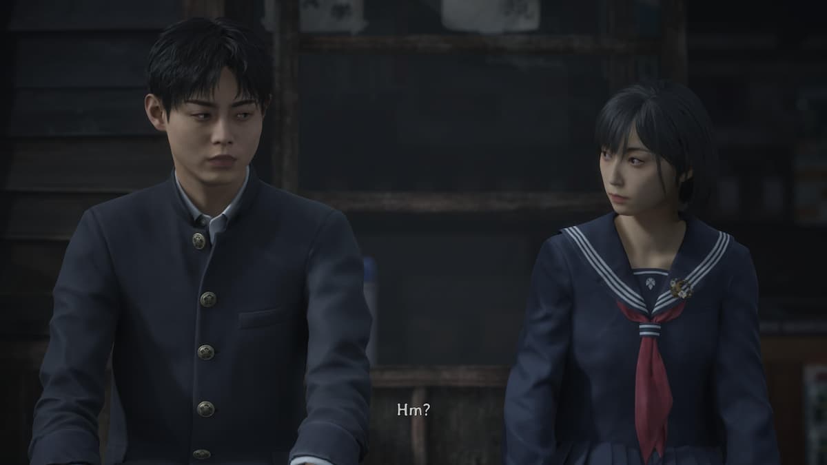 A boy and girl sitting next to each other.