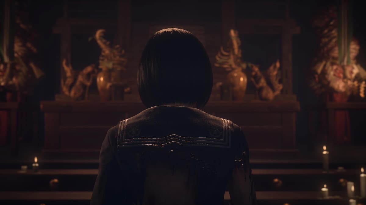 A girl looking at a shrine in Silent Hill f.
