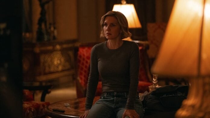 pluribus episode 6 carol A woman sitting down looking shocked in Pluribus.