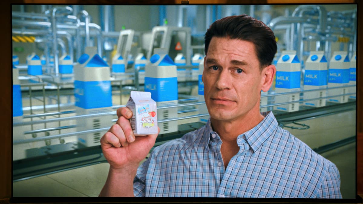 A man holding a milk carton.