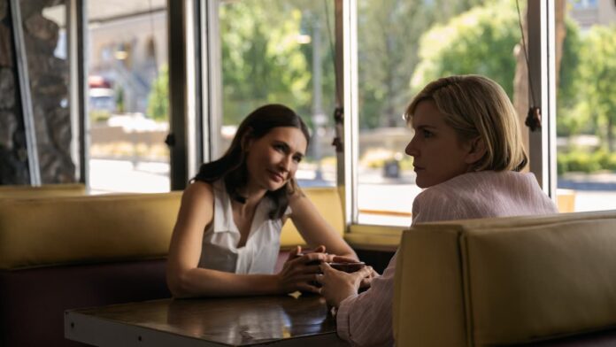 pluribus carol and zosia cafe Two women sitting at a cafe in Pluribus.