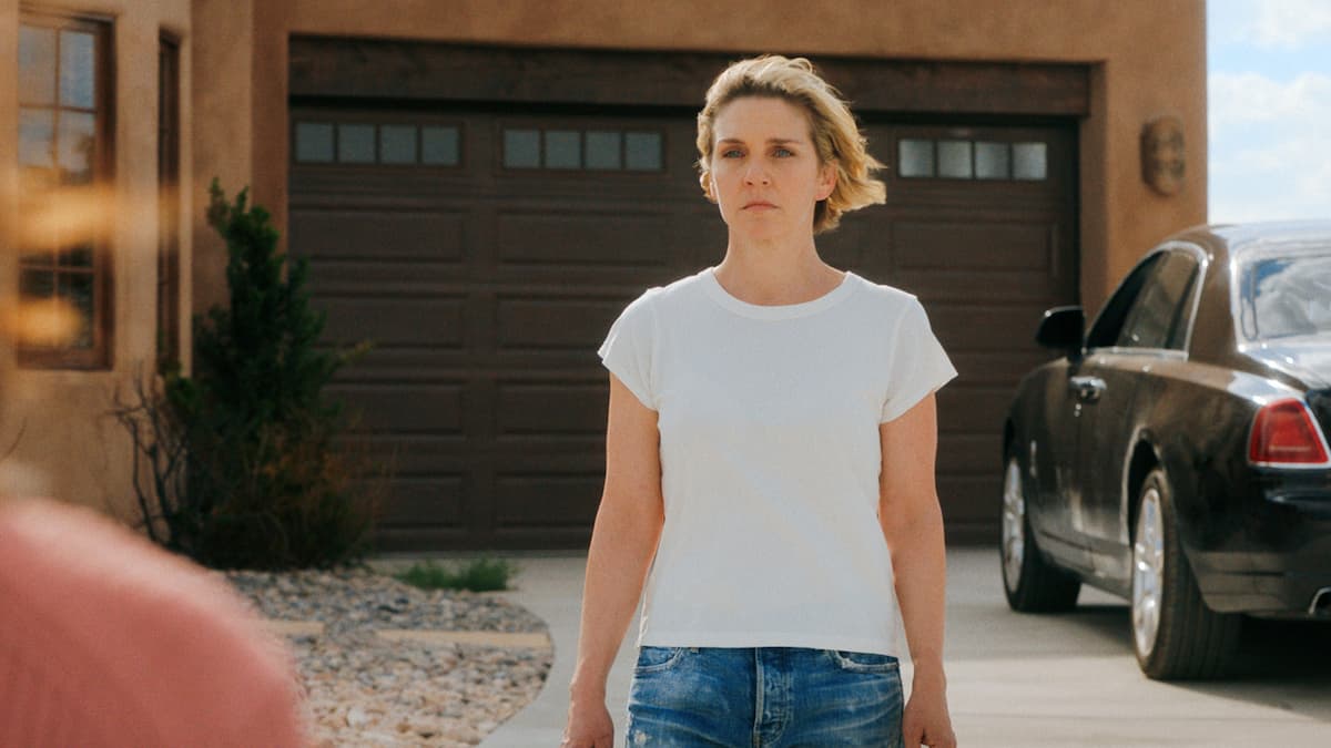 A woman in a white shirt and jeans.