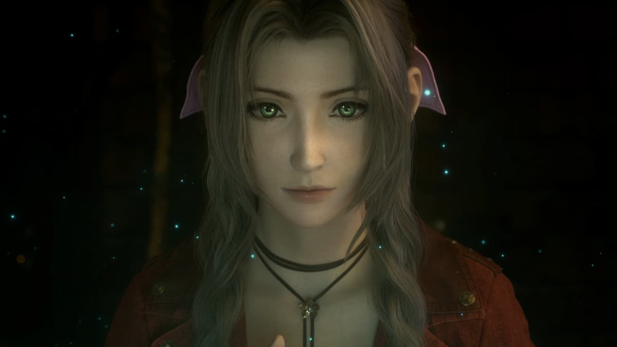 A girl with brown hair and a red jacket looking straight ahead.