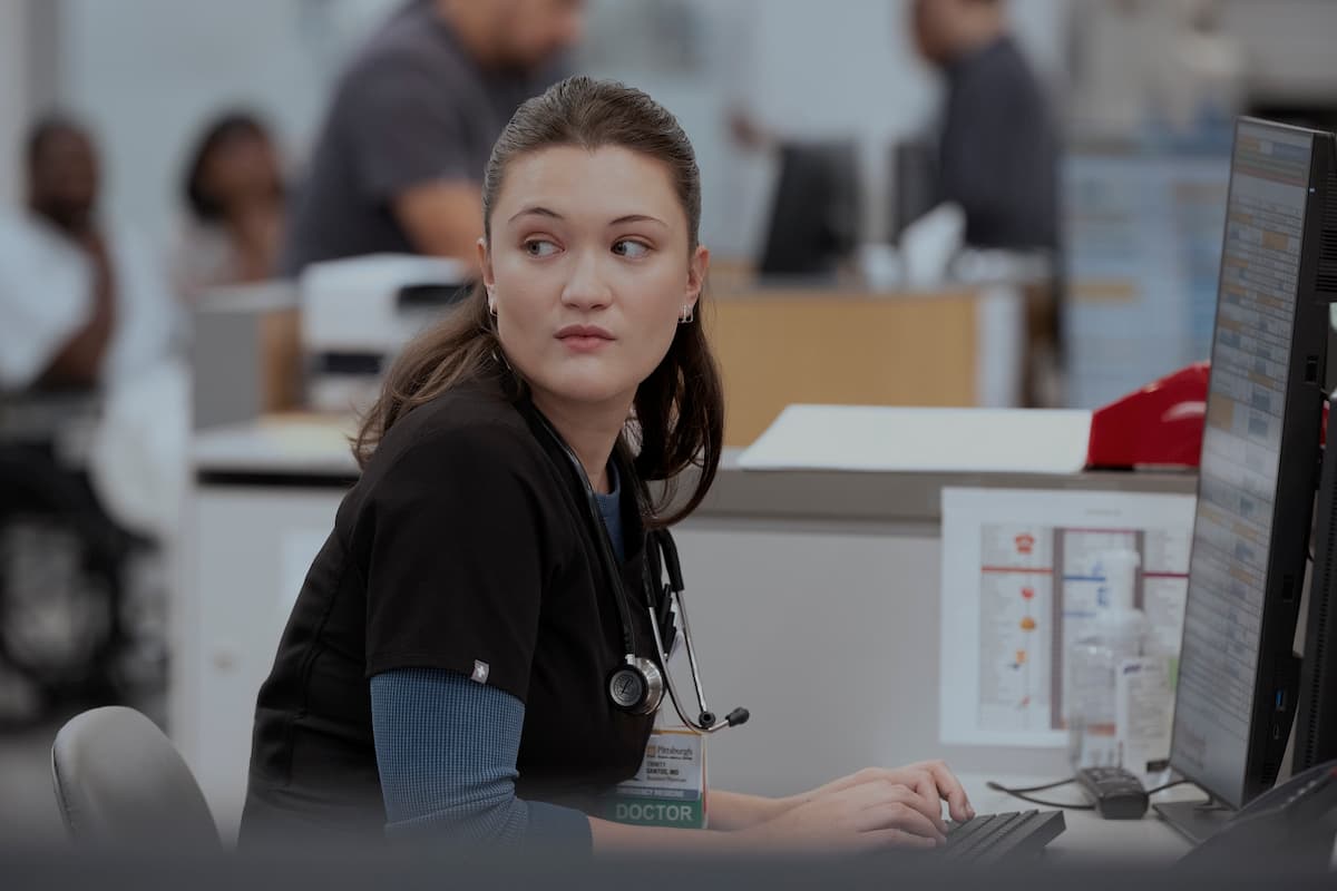 A woman sitting at a desk.