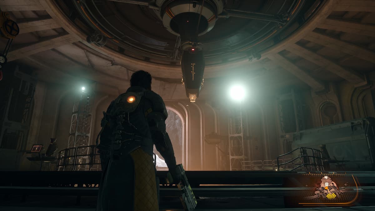 A man looking at a monolith in the ceiling.