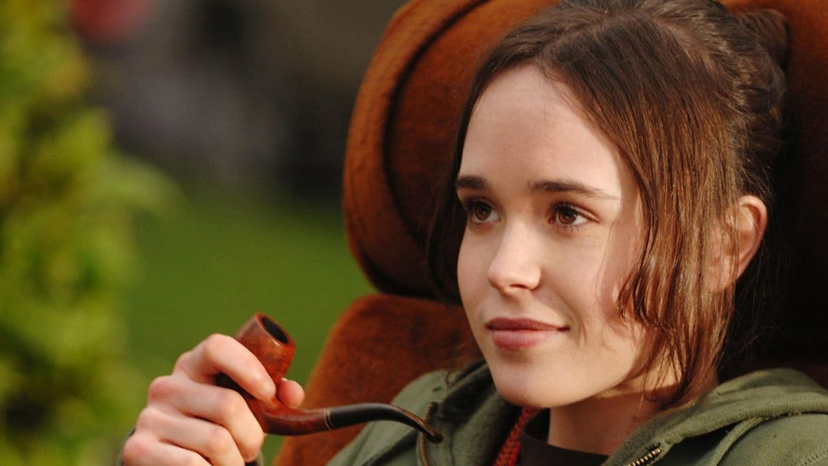A girl holding a pipe.