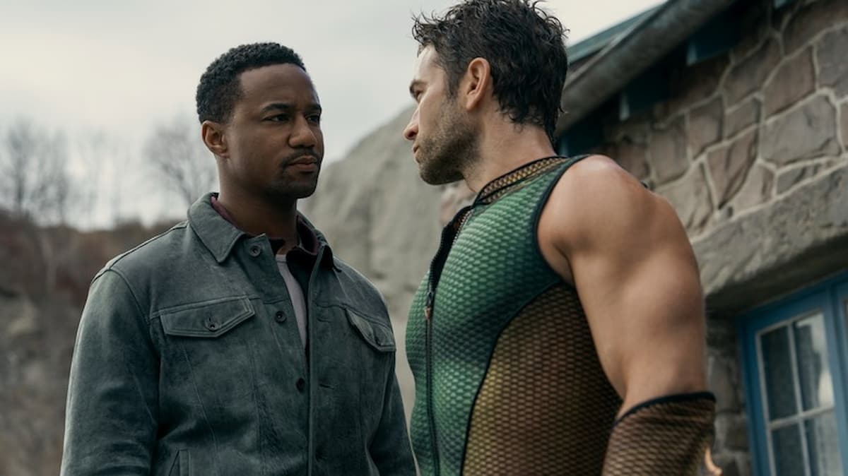 Two men staring at each other.