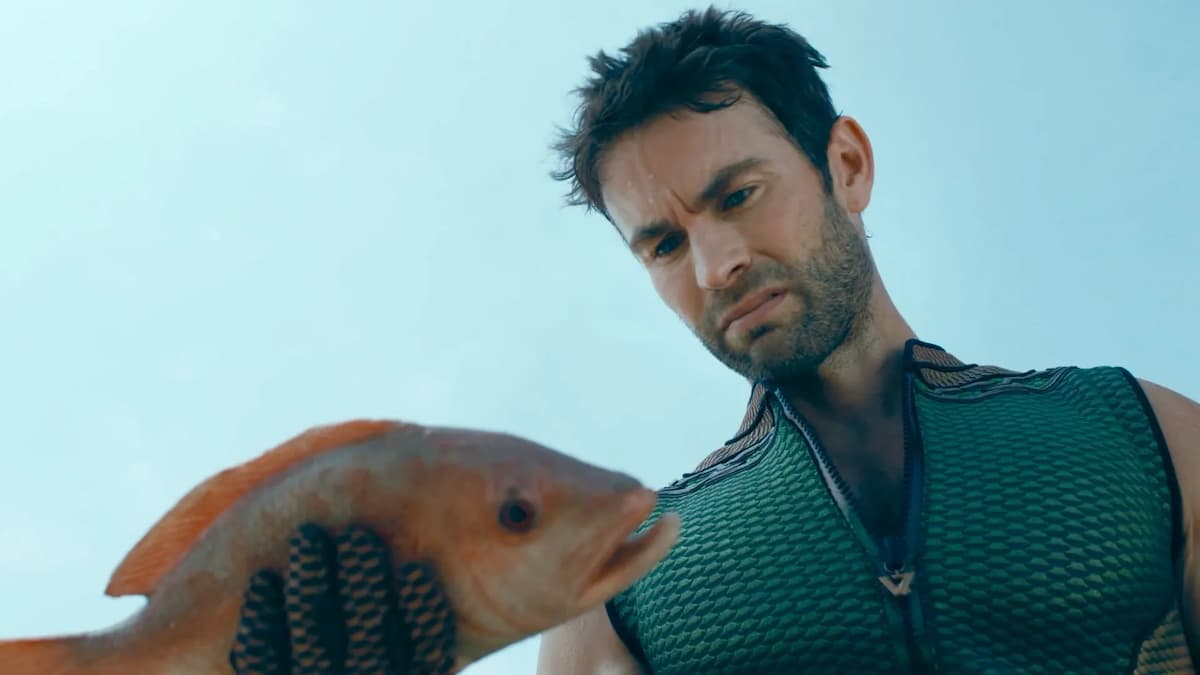 A man looking at a fish.