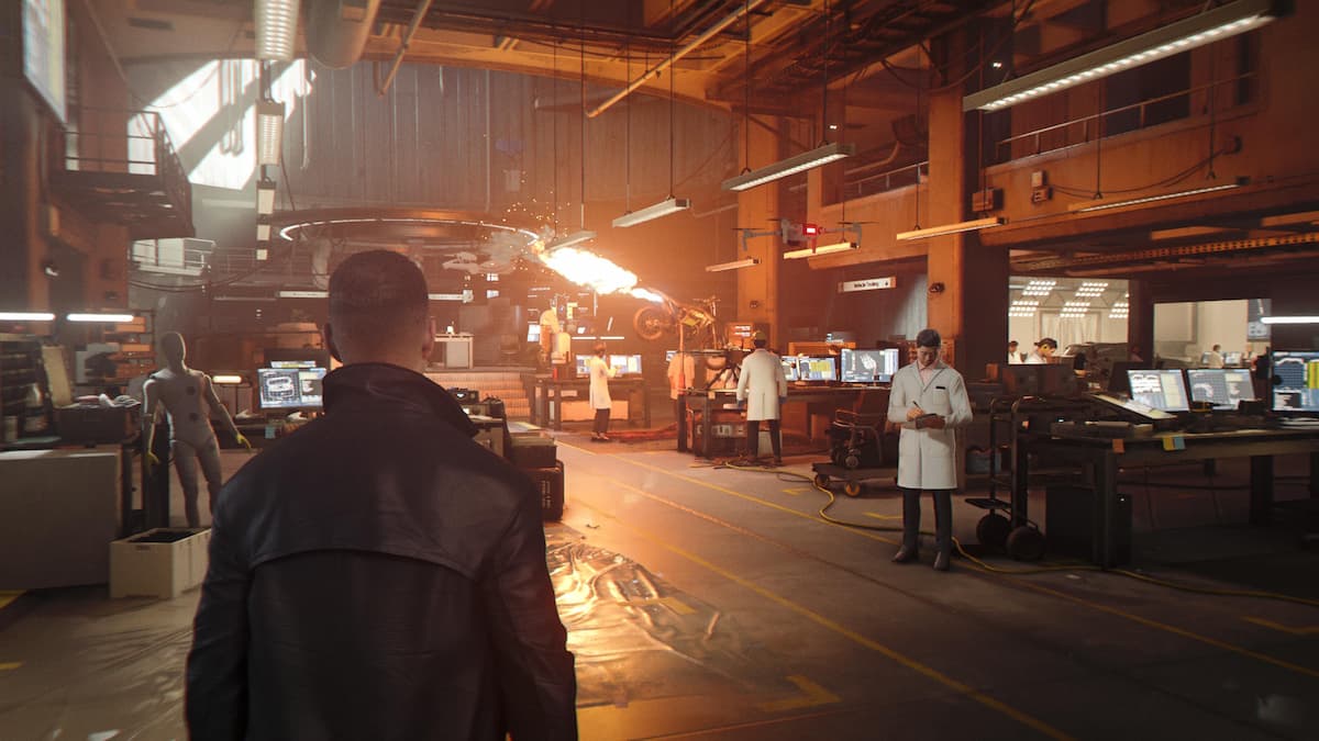 A man in a lab for our 007 First Light review.