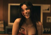 The Inherent Cruelty of Bear’s Wish in Obsession A woman with blood on her face in Obsession.