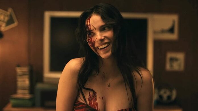 obsession cover A woman with blood on her face in Obsession.