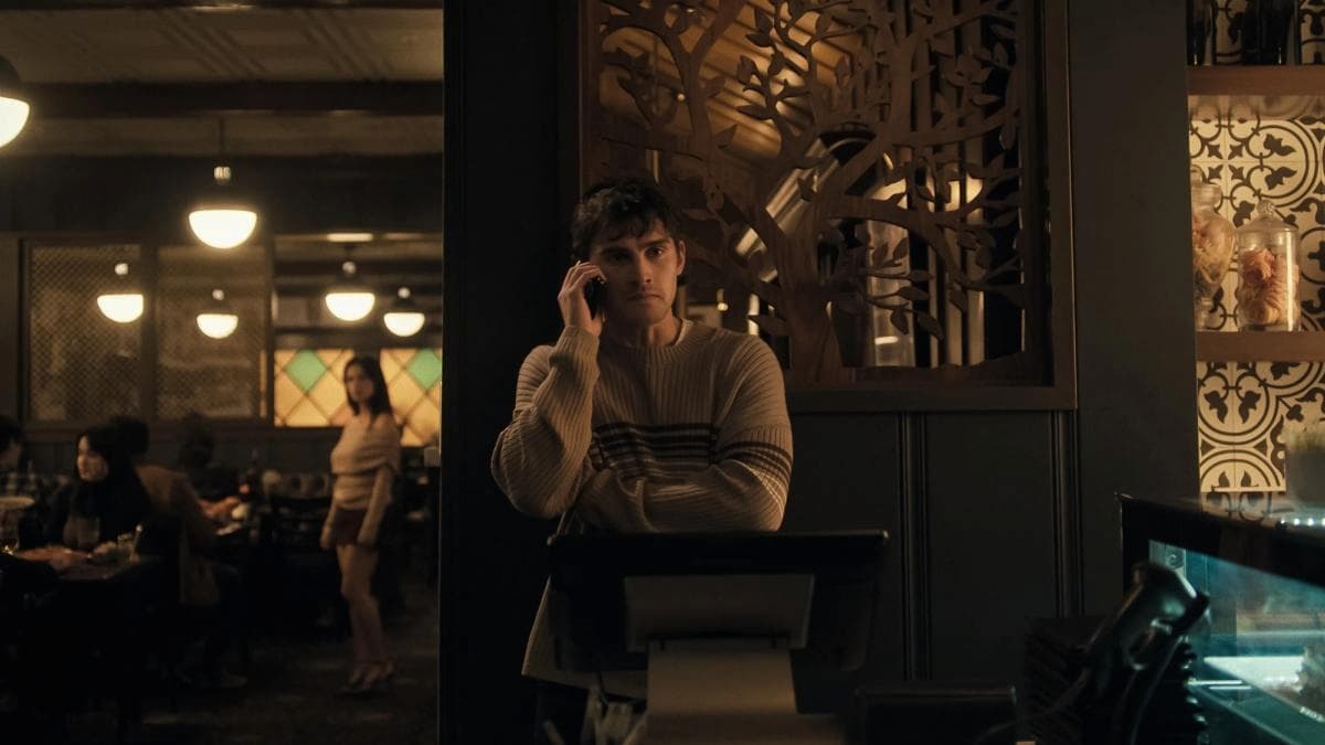 A man talking on the phone in Obsession.