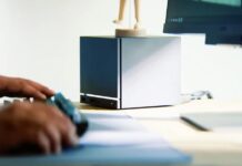 The Steam Machine’s $1,000 Price Tag Is Disappointing, But I Get It A black box on a desk. Steam Machine cover.