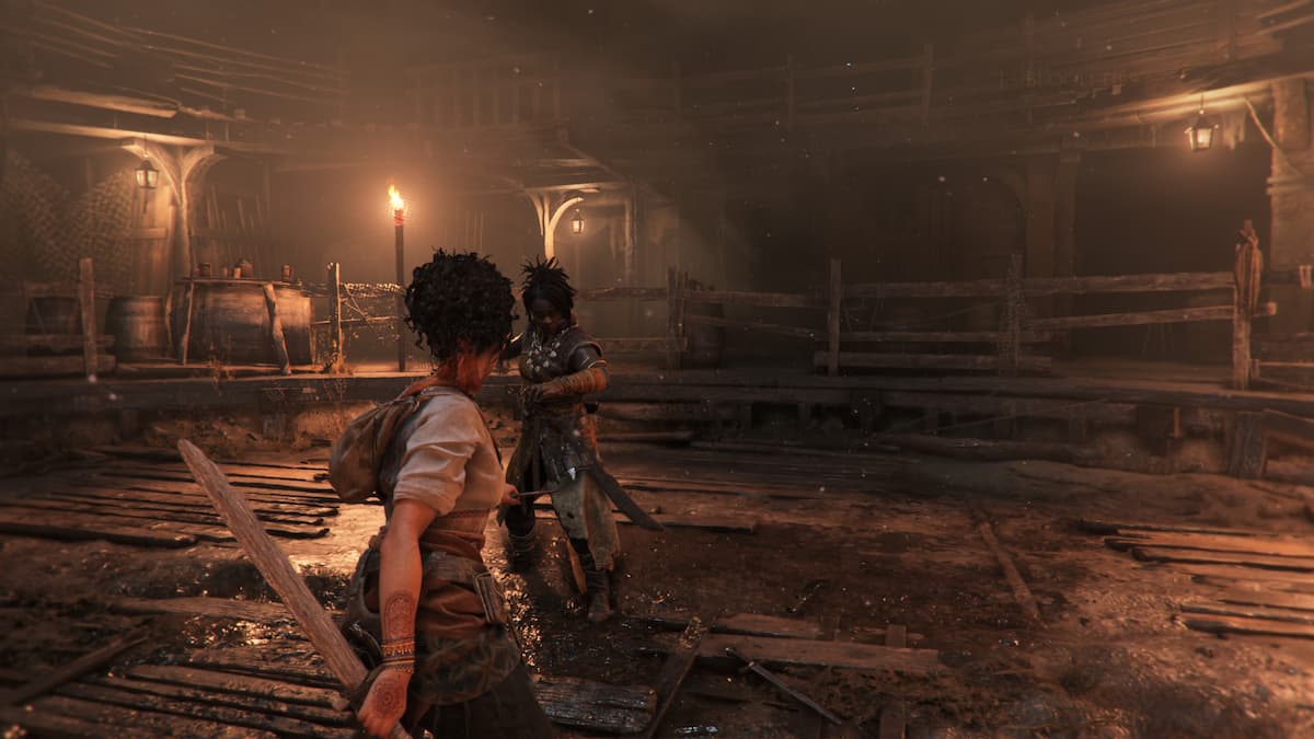 A woman fighting in an arena.